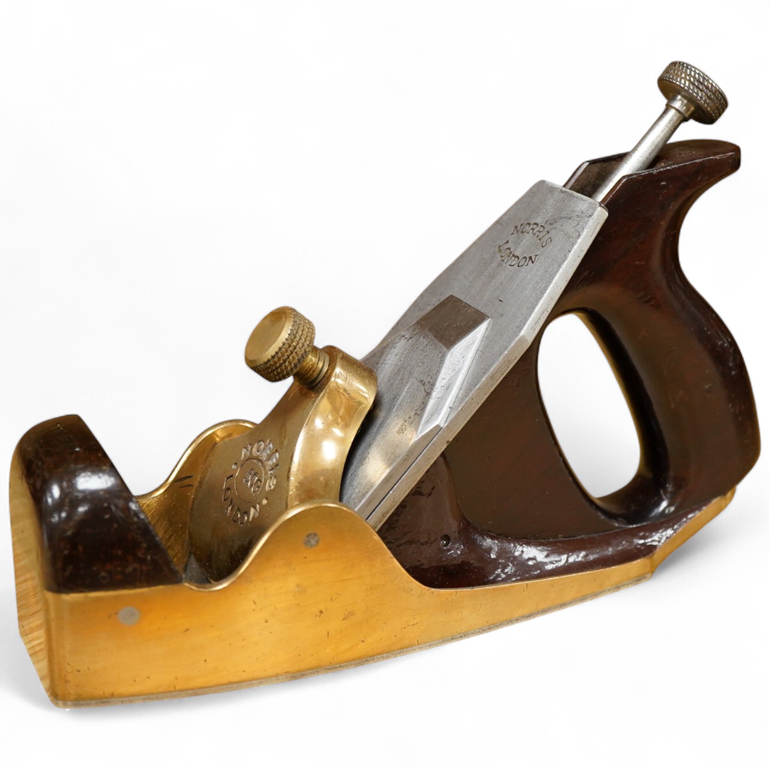 A Norris 50G adjustable gunmetal, steel soled smoothing plane, stamped with Norris, London to both the brass lever cap and the iron, with owner’s name stamped to the handle